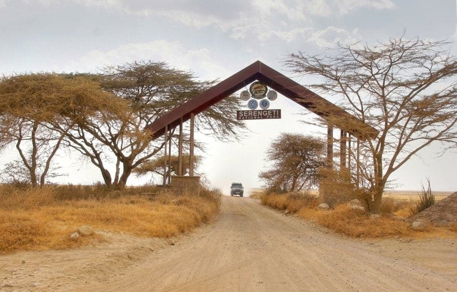 Jeep going through the Serengeti National Park entrance gate