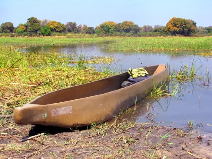 Mokoro boat on the bank of the Okavango river