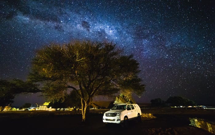 Toyota Hilux with roof top tent under the stars, Namibia