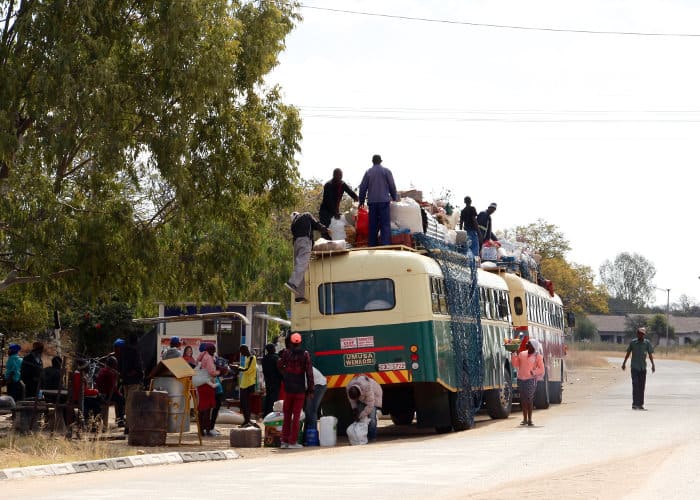 Passengers prepare to board a rural bus in the Marula and Plumtree area of Zimbabwe