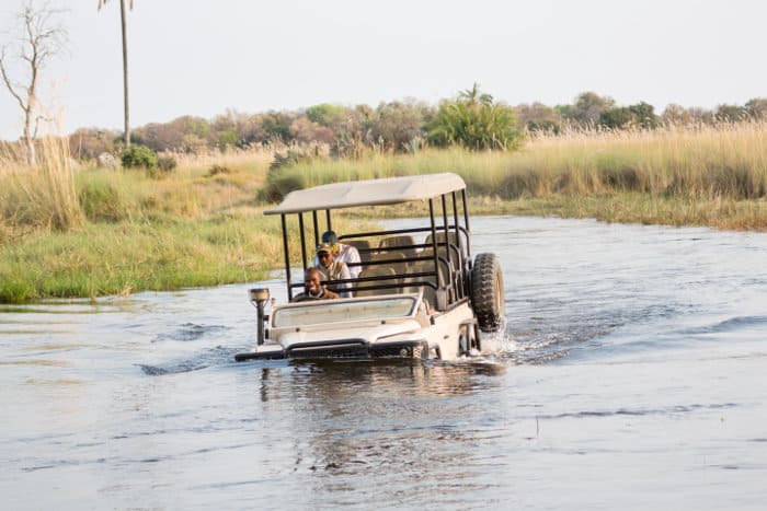 Half submerged safari jeep in the Okavango Delta