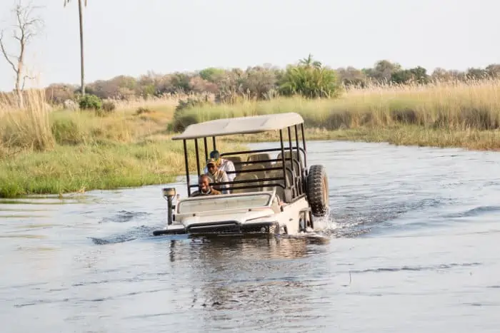 Half submerged safari jeep in the Okavango Delta
