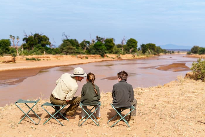 Father and kids enjoying the view of the Ewaso Ng'iro river in Samburu