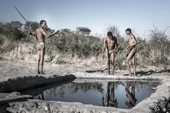 San bushmen near a water source in the Kalahari desert