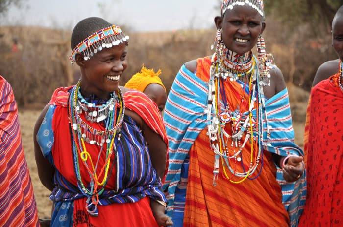 Beautiful Maasai women wearing colorful jewelry (necklaces and earrings)